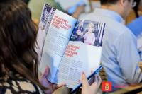 Woman reading an article on reducing food waste