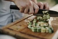 Chef chopping cucumbers