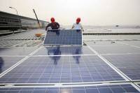 Technicians installing solar panels