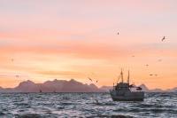 A small fishing boat in the ocean.