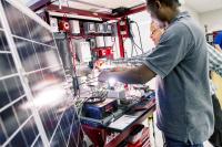 People working on solar panels